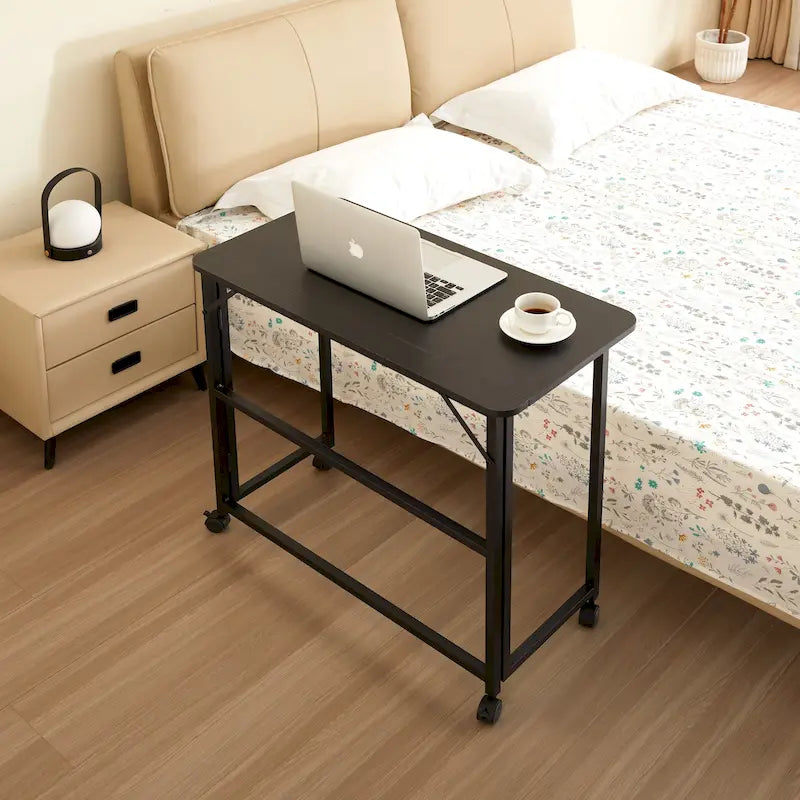 Bureau pliable noir une personne sur roulettes