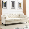 Canapé Chesterfield 3 places capitonné beige/gris avec accoudoirs roulés et cloutage décoratif