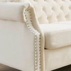 Canapé Chesterfield 3 places capitonné beige/gris avec accoudoirs roulés et cloutage décoratif